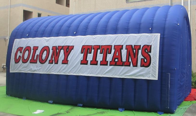 Blue inflatable tunnel with Colony Titans on the side