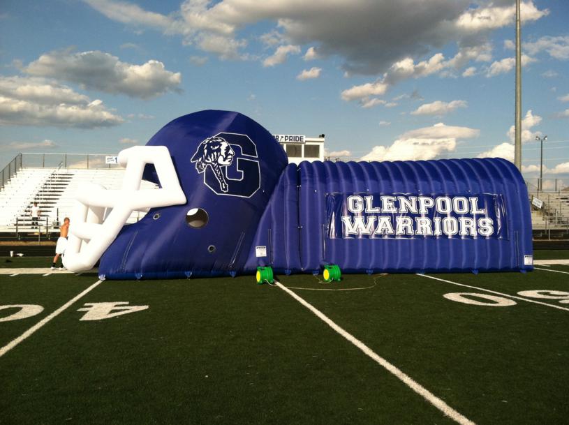 Blue inflatable tunnel on the field.